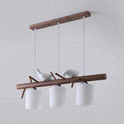 3 Lights Nutcracker Wood Island Pendant Lighting Contemporary Cylindrical Glass Shade Island Lamps Brown Clearhalo 'Ceiling Lights' 'Island Lights' Lighting' 2557065