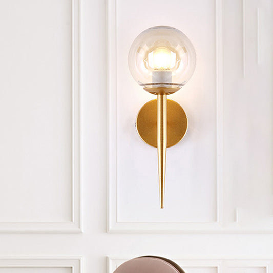 Clear Glass Globe Wall Sconce Modern 1 Light Living Room Lighting Fixture in Gold Clearhalo 'Cast Iron' 'Glass' 'Industrial wall lights' 'Industrial' 'Middle century wall lights' 'Modern' 'Tiffany' 'Traditional wall lights' 'Wall Lamps & Sconces' 'Wall Lights' Lighting' 256161