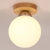 Modern Wood Ceiling Light Simplicity 1-Light Flush Mount Light for Bedroom Wood Globe Clearhalo 'Ceiling Lights' 'Close To Ceiling Lights' 'Close to ceiling' 'Semi-flushmount' Lighting' 2562531