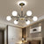 Spherical Chandelier Lighting Ultra-Contemporary Milk Glass Hanging Ceiling Lights for Living Room 6 Black Clearhalo 'Ceiling Lights' 'Chandeliers' 'Modern Chandeliers' 'Modern' Lighting' 2569358
