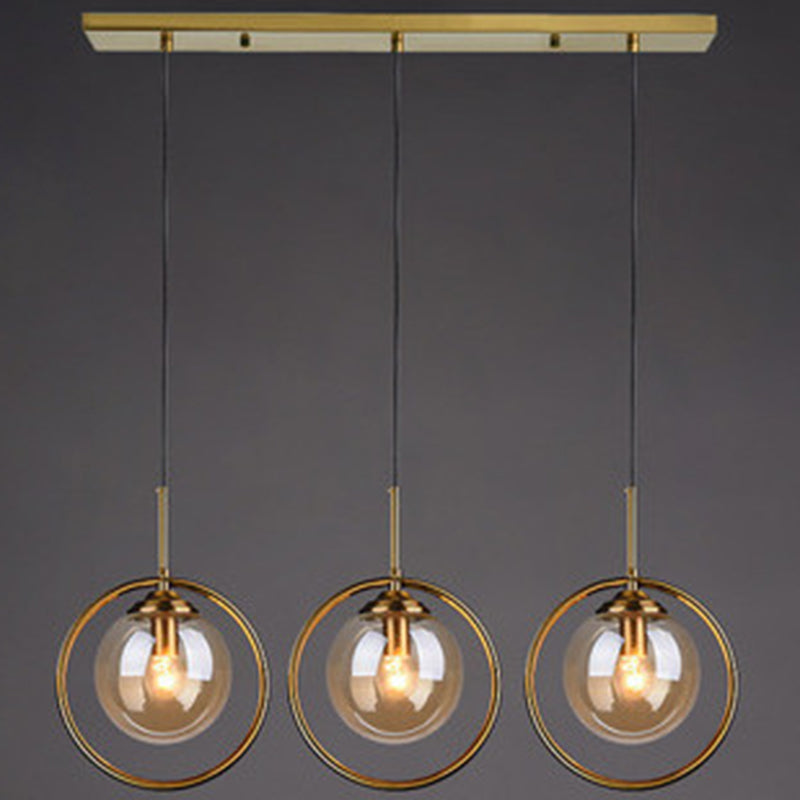 Mid-Century Design Globe Hanging Lamp Glass Shade with Metal Ring For Bedroom Amber Linear Clearhalo 'Ceiling Lights' 'Glass shade' 'Glass' 'Modern Pendants' 'Modern' 'Pendant Lights' 'Pendants' Lighting' 2579312