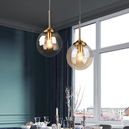 Mid-Century Design Globe Hanging Lamp Glass Shade with Metal Ring For Bedroom Amber Round Clearhalo 'Ceiling Lights' 'Glass shade' 'Glass' 'Modern Pendants' 'Modern' 'Pendant Lights' 'Pendants' Lighting' 2579316