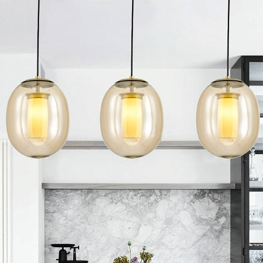 Clear Glass Oval Hanging Lamp Kit Contemporary 7"/8.5" Wide 1 Head Gold Pendant Light for Dining Room Clearhalo 'Ceiling Lights' 'Chandeliers' 'Glass shade' 'Glass' 'Modern Pendants' 'Modern' 'Pendant Lights' 'Pendants' Lighting' 258672
