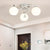 Spherical Semi Flush Mount Ceiling Light Modernist White Glass Ceiling Light Fixture for Bedroom 3 White Globe Clearhalo 'Ceiling Lights' 'Close To Ceiling Lights' 'Close to ceiling' 'Semi-flushmount' Lighting' 2588406