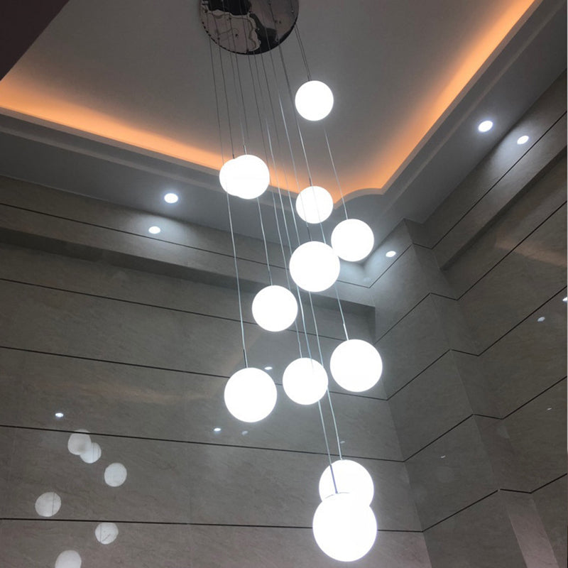 Cream Glass Spherical Multi Pendant Chandelier Simplicity Silver Ceiling Hang Lamp for Lobby Stairs 12 Silver Clearhalo 'Ceiling Lights' 'Modern Pendants' 'Modern' 'Pendant Lights' 'Pendants' Lighting' 2592939