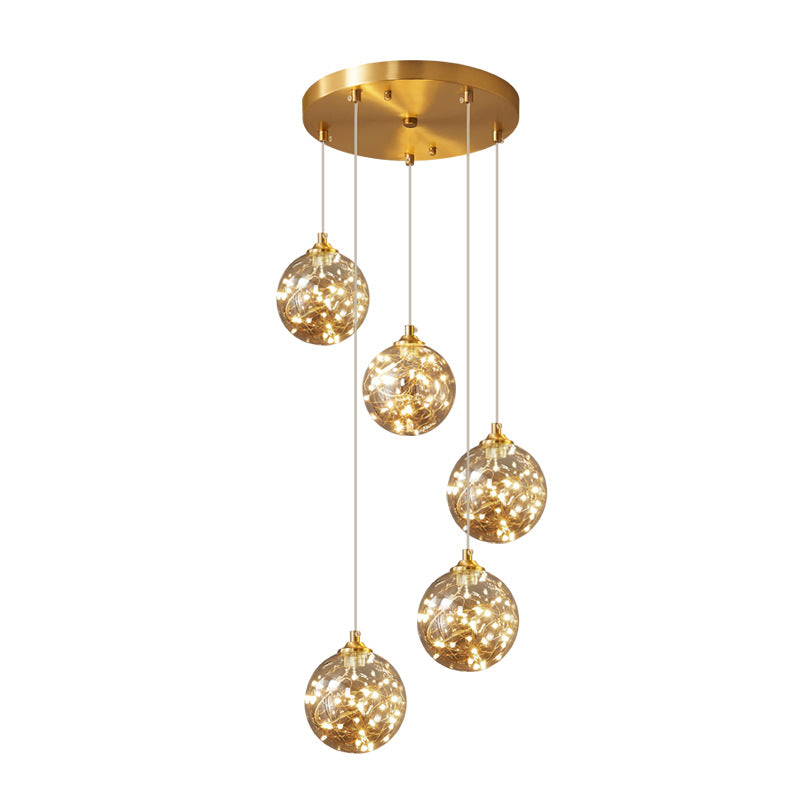 Brass Finish Globe Suspension Lamp Nordic Amber Glass LED Starry Pendant Lighting for Bedroom Clearhalo 'Ceiling Lights' 'Glass shade' 'Glass' 'Modern Pendants' 'Modern' 'Pendant Lights' 'Pendants' Lighting' 2593462