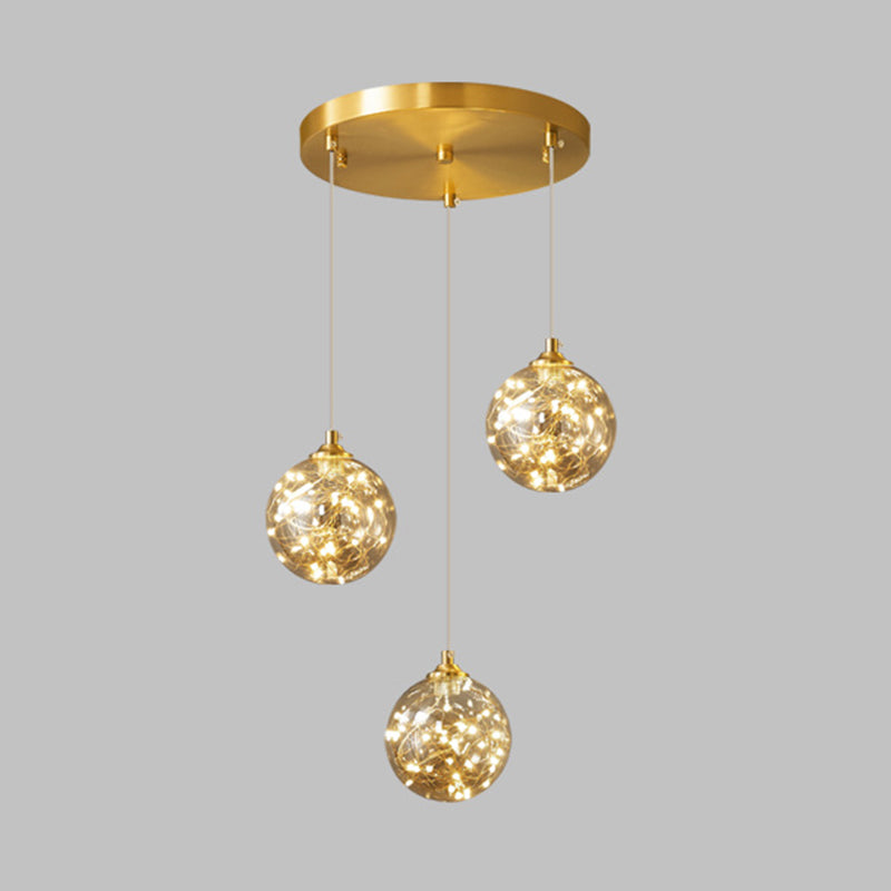 Brass Finish Globe Suspension Lamp Nordic Amber Glass LED Starry Pendant Lighting for Bedroom 3 Brass Clearhalo 'Ceiling Lights' 'Glass shade' 'Glass' 'Modern Pendants' 'Modern' 'Pendant Lights' 'Pendants' Lighting' 2593463
