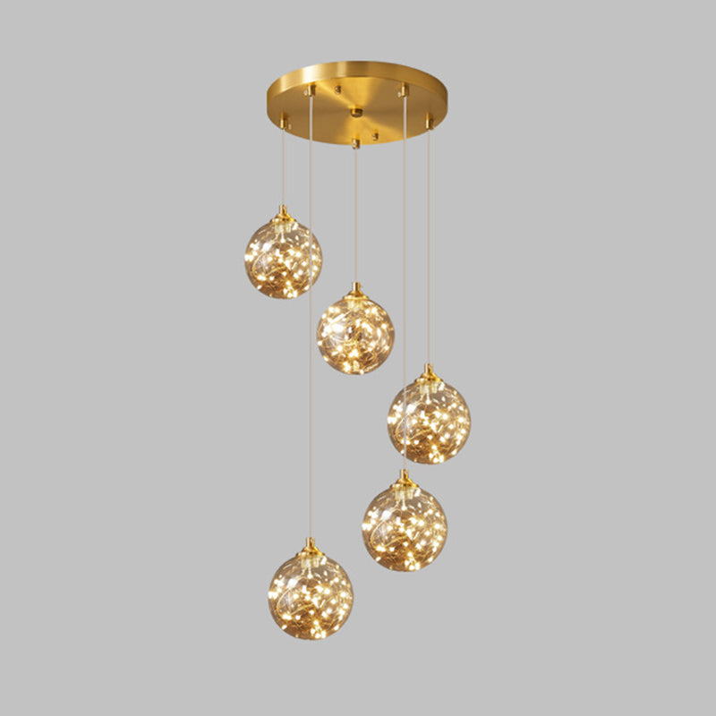 Brass Finish Globe Suspension Lamp Nordic Amber Glass LED Starry Pendant Lighting for Bedroom 5 Brass Clearhalo 'Ceiling Lights' 'Glass shade' 'Glass' 'Modern Pendants' 'Modern' 'Pendant Lights' 'Pendants' Lighting' 2593464