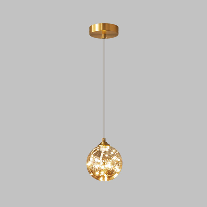 Brass Finish Globe Suspension Lamp Nordic Amber Glass LED Starry Pendant Lighting for Bedroom 1 Brass Clearhalo 'Ceiling Lights' 'Glass shade' 'Glass' 'Modern Pendants' 'Modern' 'Pendant Lights' 'Pendants' Lighting' 2593466