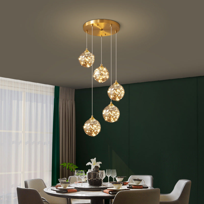 Brass Finish Globe Suspension Lamp Nordic Amber Glass LED Starry Pendant Lighting for Bedroom Clearhalo 'Ceiling Lights' 'Glass shade' 'Glass' 'Modern Pendants' 'Modern' 'Pendant Lights' 'Pendants' Lighting' 2593467