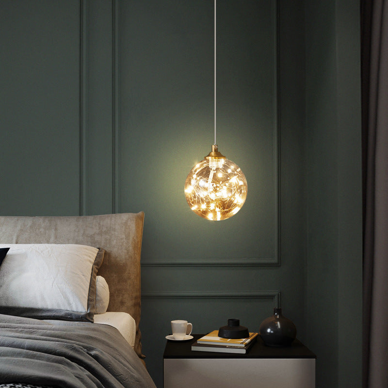 Brass Finish Globe Suspension Lamp Nordic Amber Glass LED Starry Pendant Lighting for Bedroom Clearhalo 'Ceiling Lights' 'Glass shade' 'Glass' 'Modern Pendants' 'Modern' 'Pendant Lights' 'Pendants' Lighting' 2593468