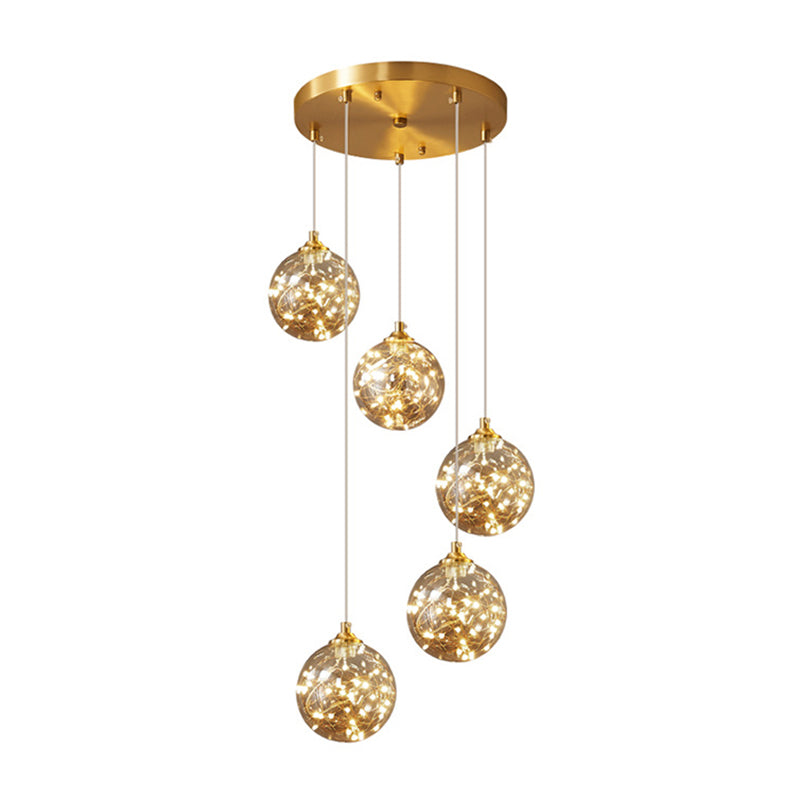 Brass Finish Globe Suspension Lamp Nordic Amber Glass LED Starry Pendant Lighting for Bedroom Clearhalo 'Ceiling Lights' 'Glass shade' 'Glass' 'Modern Pendants' 'Modern' 'Pendant Lights' 'Pendants' Lighting' 2593469