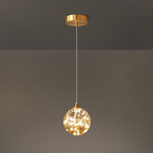 Brass Finish Globe Suspension Lamp Nordic Amber Glass LED Starry Pendant Lighting for Bedroom Clearhalo 'Ceiling Lights' 'Glass shade' 'Glass' 'Modern Pendants' 'Modern' 'Pendant Lights' 'Pendants' Lighting' 2593471
