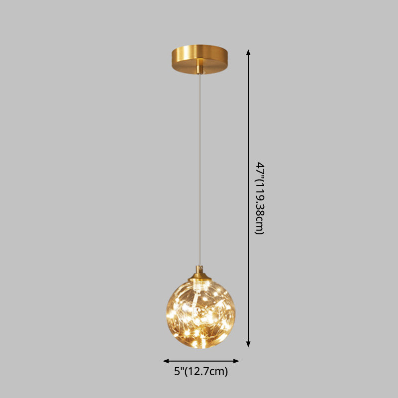 Brass Finish Globe Suspension Lamp Nordic Amber Glass LED Starry Pendant Lighting for Bedroom Clearhalo 'Ceiling Lights' 'Glass shade' 'Glass' 'Modern Pendants' 'Modern' 'Pendant Lights' 'Pendants' Lighting' 2593474