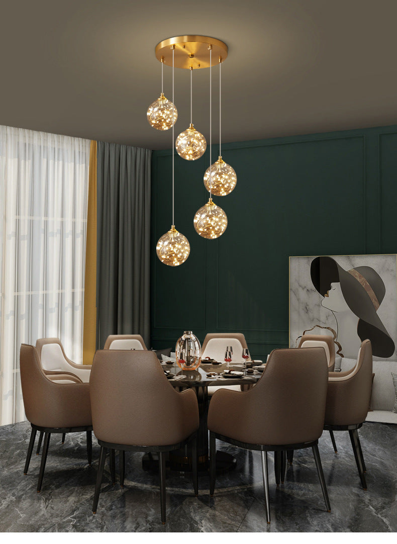 Brass Finish Globe Suspension Lamp Nordic Amber Glass LED Starry Pendant Lighting for Bedroom Clearhalo 'Ceiling Lights' 'Glass shade' 'Glass' 'Modern Pendants' 'Modern' 'Pendant Lights' 'Pendants' Lighting' 2593475