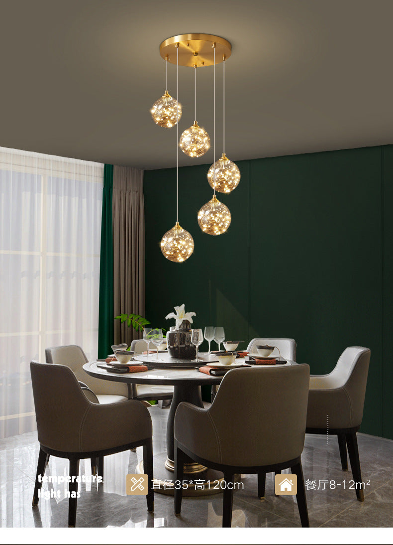 Brass Finish Globe Suspension Lamp Nordic Amber Glass LED Starry Pendant Lighting for Bedroom Clearhalo 'Ceiling Lights' 'Glass shade' 'Glass' 'Modern Pendants' 'Modern' 'Pendant Lights' 'Pendants' Lighting' 2593476