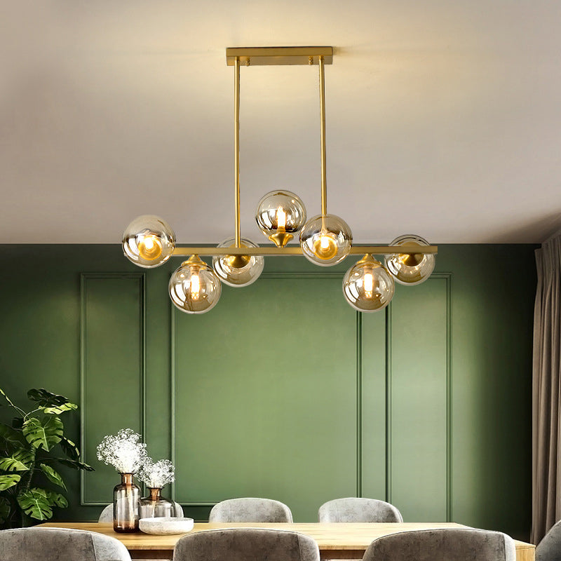 Mid-Century Modern Gold Metal Island Pendant Lighting Spherical Amber Glass Island Ceiling Light for Dining Table Clearhalo 'Ceiling Lights' 'Island Lights' 'Lighting' 2605090