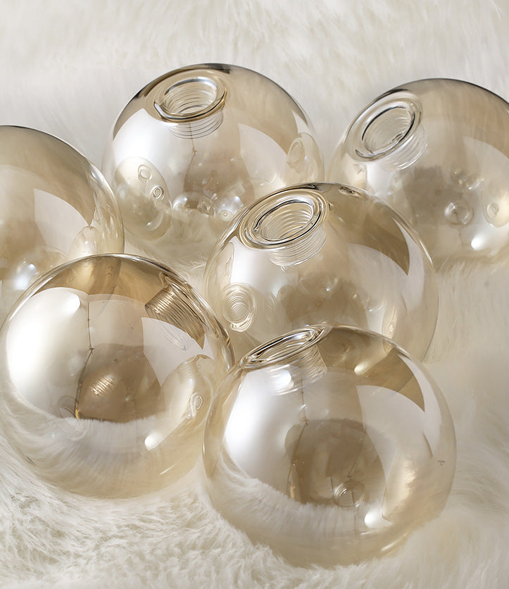 Mid-Century Modern Gold Metal Island Pendant Lighting Spherical Amber Glass Island Ceiling Light for Dining Table Clearhalo 'Ceiling Lights' 'Island Lights' 'Lighting' 2605096