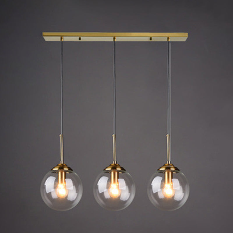 3 Lights Globe Hanging Ceiling Lights Minimalist Glass Multi Light Pendant for Restaurant Clear Linear Clearhalo 'Ceiling Lights' 'Pendant Lights' 'Pendants' Lighting' 2630016_c6fa04a4-1293-4b45-8fd2-aac0cc2aae78