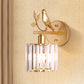 K9 Crystal Cylinder Wall Mounted Lamp Contemporary 1 Bulb Wall Sconce with Bird Accent in Black/Gold Gold Clearhalo 'Modern wall lights' 'Modern' 'Wall Lamps & Sconces' 'Wall Lights' Lighting' 265465