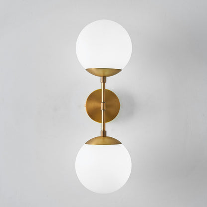 Armed Double Globe Wall Sconce Light Minimalist Milky Glass 2-Light Wall Mount Lamp in Brass Brass Clearhalo 'Cast Iron' 'Glass' 'Industrial' 'Modern wall lights' 'Modern' 'Tiffany' 'Traditional wall lights' 'Wall Lamps & Sconces' 'Wall Lights' Lighting' 269656