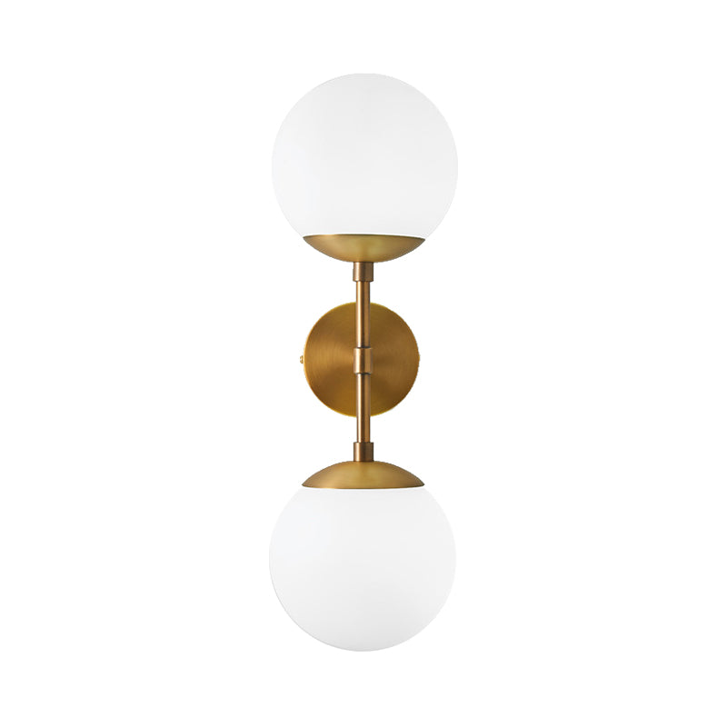 Armed Double Globe Wall Sconce Light Minimalist Milky Glass 2-Light Wall Mount Lamp in Brass Clearhalo 'Cast Iron' 'Glass' 'Industrial' 'Modern wall lights' 'Modern' 'Tiffany' 'Traditional wall lights' 'Wall Lamps & Sconces' 'Wall Lights' Lighting' 269658