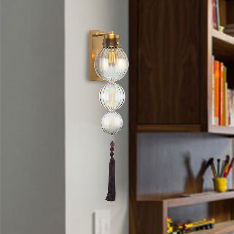 Brass/Chrome Finish Sphere Sconce Light Chinese Style 1 Bulb Clear/Amber/Light Blue Glass Wall Mount Lamp with Tassel Knot Clearhalo 'Cast Iron' 'Glass' 'Industrial' 'Modern wall lights' 'Modern' 'Tiffany' 'Traditional wall lights' 'Wall Lamps & Sconces' 'Wall Lights' Lighting' 273085