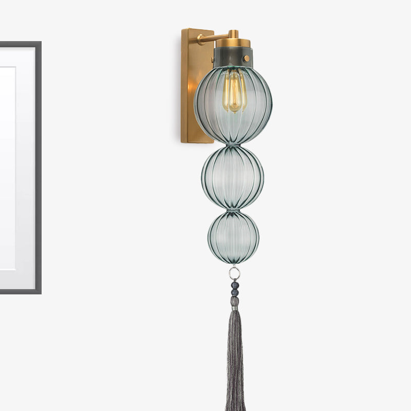 Brass/Chrome Finish Sphere Sconce Light Chinese Style 1 Bulb Clear/Amber/Light Blue Glass Wall Mount Lamp with Tassel Knot Brass Light Blue Clearhalo 'Cast Iron' 'Glass' 'Industrial' 'Modern wall lights' 'Modern' 'Tiffany' 'Traditional wall lights' 'Wall Lamps & Sconces' 'Wall Lights' Lighting' 273089