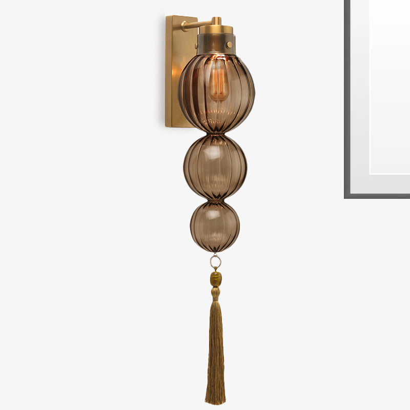 Brass/Chrome Finish Sphere Sconce Light Chinese Style 1 Bulb Clear/Amber/Light Blue Glass Wall Mount Lamp with Tassel Knot Brass Amber Clearhalo 'Cast Iron' 'Glass' 'Industrial' 'Modern wall lights' 'Modern' 'Tiffany' 'Traditional wall lights' 'Wall Lamps & Sconces' 'Wall Lights' Lighting' 273094