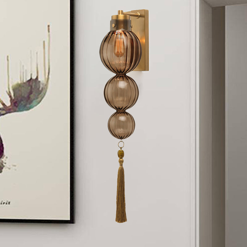 Brass/Chrome Finish Sphere Sconce Light Chinese Style 1 Bulb Clear/Amber/Light Blue Glass Wall Mount Lamp with Tassel Knot Clearhalo 'Cast Iron' 'Glass' 'Industrial' 'Modern wall lights' 'Modern' 'Tiffany' 'Traditional wall lights' 'Wall Lamps & Sconces' 'Wall Lights' Lighting' 273095