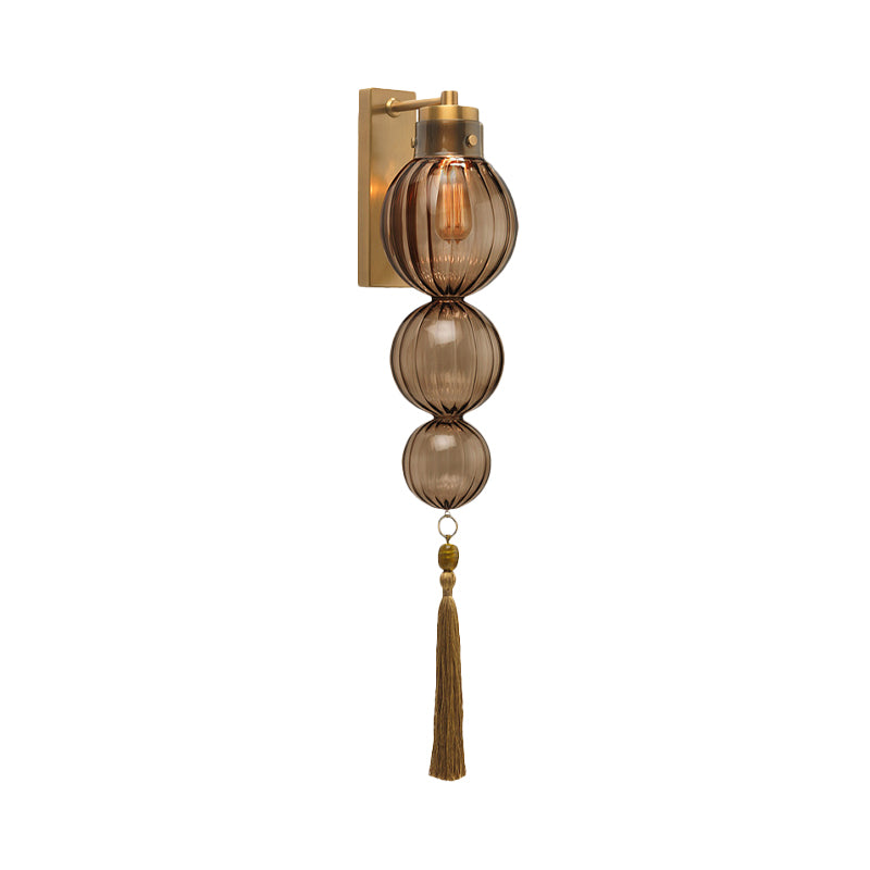Brass/Chrome Finish Sphere Sconce Light Chinese Style 1 Bulb Clear/Amber/Light Blue Glass Wall Mount Lamp with Tassel Knot Clearhalo 'Cast Iron' 'Glass' 'Industrial' 'Modern wall lights' 'Modern' 'Tiffany' 'Traditional wall lights' 'Wall Lamps & Sconces' 'Wall Lights' Lighting' 273097