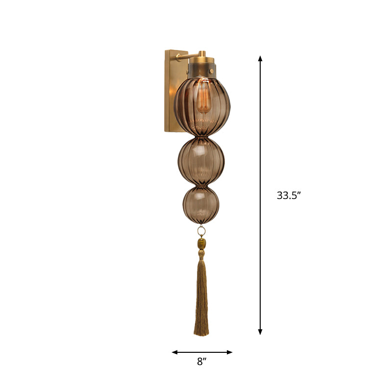 Brass/Chrome Finish Sphere Sconce Light Chinese Style 1 Bulb Clear/Amber/Light Blue Glass Wall Mount Lamp with Tassel Knot Clearhalo 'Cast Iron' 'Glass' 'Industrial' 'Modern wall lights' 'Modern' 'Tiffany' 'Traditional wall lights' 'Wall Lamps & Sconces' 'Wall Lights' Lighting' 273098