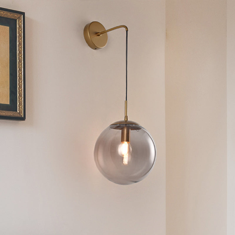Clear/Smoke Grey Glass Sphere Wall Sconce Retro 1 Light Wall Mount Lamp with Long Gold/Black Arm - Gold - Clearhalo - 'Cast Iron' - 'Glass' - 'Industrial' - 'Modern wall lights' - 'Modern' - 'Tiffany' - 'Traditional wall lights' - 'Wall Lamps & Sconces' - 'Wall Lights' - Lighting' - 273156