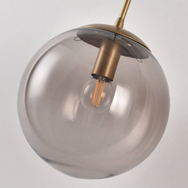 Clear/Smoke Grey Glass Sphere Wall Sconce Retro 1 Light Wall Mount Lamp with Long Gold/Black Arm - Clearhalo - 'Cast Iron' - 'Glass' - 'Industrial' - 'Modern wall lights' - 'Modern' - 'Tiffany' - 'Traditional wall lights' - 'Wall Lamps & Sconces' - 'Wall Lights' - Lighting' - 273161