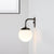 1 Bulb Bedside Sconce Light Minimalist Golden/Black Wall Lamp with Milky Glass Ball Shade Black Clearhalo 'Cast Iron' 'Glass' 'Industrial' 'Modern wall lights' 'Modern' 'Tiffany' 'Traditional wall lights' 'Wall Lamps & Sconces' 'Wall Lights' Lighting' 273228