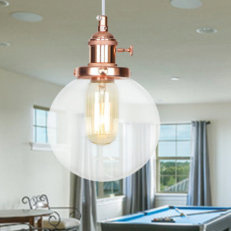 Orbit Hanging Lighting Farmhouse Amber/Clear Glass 1 Bulb Pendant Light Fixture with Adjustable Cord in Black/Bronze/Brass Finish Rose Gold Clear Clearhalo 'Art Deco Pendants' 'Black' 'Cast Iron' 'Ceiling Lights' 'Ceramic' 'Crystal' 'Industrial Pendants' 'Industrial' 'Metal' 'Middle Century Pendants' 'Pendant Lights' 'Pendants' 'Rustic Pendants' 'Tiffany' Lighting' 273891