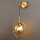 Orbit Smoke Gray/Clear/Amber Glass Wall Lamp Contemporary Single Brass Finish Sconce Light Fixture Clearhalo 'Cast Iron' 'Glass' 'Industrial' 'Modern wall lights' 'Modern' 'Tiffany' 'Traditional wall lights' 'Wall Lamps & Sconces' 'Wall Lights' Lighting' 274465