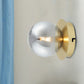 Single Bedroom Wall Sconce Light Simplicity Golden Wall Light Fixture with Smoke Grey Sphere Glass Shade Clearhalo 'Cast Iron' 'Glass' 'Industrial' 'Modern wall lights' 'Modern' 'Tiffany' 'Traditional wall lights' 'Wall Lamps & Sconces' 'Wall Lights' Lighting' 274987