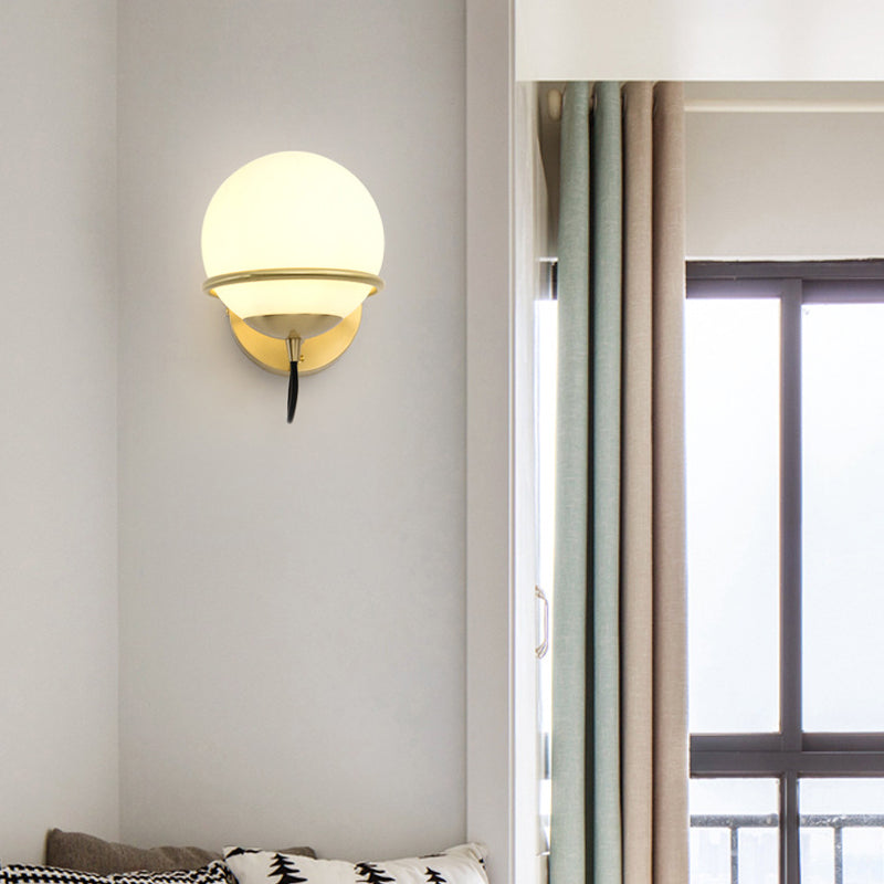 Single Wall Mount Spherical Sconce Light Contemporary Matte White Glass Brass Wall Light Fixture Clearhalo 'Cast Iron' 'Glass' 'Industrial' 'Modern wall lights' 'Modern' 'Tiffany' 'Traditional wall lights' 'Wall Lamps & Sconces' 'Wall Lights' Lighting' 275109