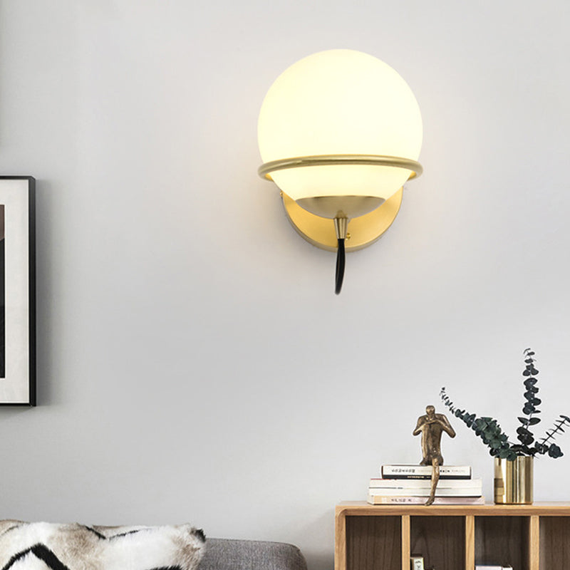 Single Wall Mount Spherical Sconce Light Contemporary Matte White Glass Brass Wall Light Fixture Clearhalo 'Cast Iron' 'Glass' 'Industrial' 'Modern wall lights' 'Modern' 'Tiffany' 'Traditional wall lights' 'Wall Lamps & Sconces' 'Wall Lights' Lighting' 275110