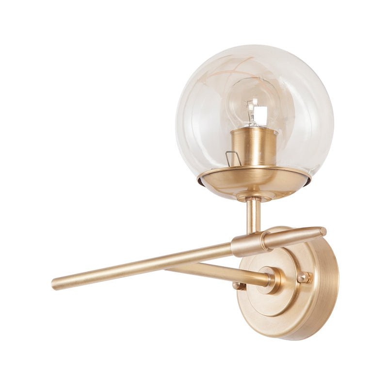 Brass Globe Wall Light Contemporary 1 Light Hand Blown Glass Sconce Light with Crossed Arm Clearhalo 'Cast Iron' 'Glass' 'Industrial' 'Modern wall lights' 'Modern' 'Tiffany' 'Traditional wall lights' 'Wall Lamps & Sconces' 'Wall Lights' Lighting' 275135