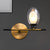Clear/Amber Glass Egg Shape Wall Light Fixture Minimalist 1 Light Brass Sconce with Horizontal Arm - Clear - Clearhalo - 'Cast Iron' - 'Glass' - 'Industrial' - 'Modern wall lights' - 'Modern' - 'Tiffany' - 'Traditional wall lights' - 'Wall Lamps & Sconces' - 'Wall Lights' - Lighting' - 275241