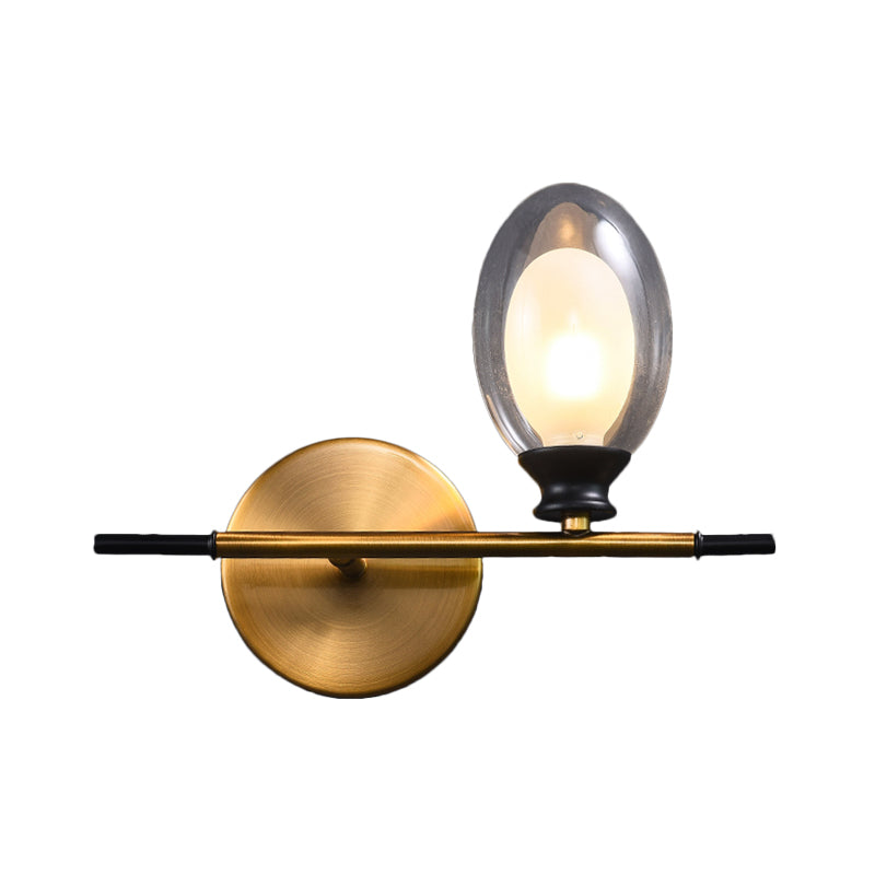 Clear/Amber Glass Egg Shape Wall Light Fixture Minimalist 1 Light Brass Sconce with Horizontal Arm Clearhalo 'Cast Iron' 'Glass' 'Industrial' 'Modern wall lights' 'Modern' 'Tiffany' 'Traditional wall lights' 'Wall Lamps & Sconces' 'Wall Lights' Lighting' 275245