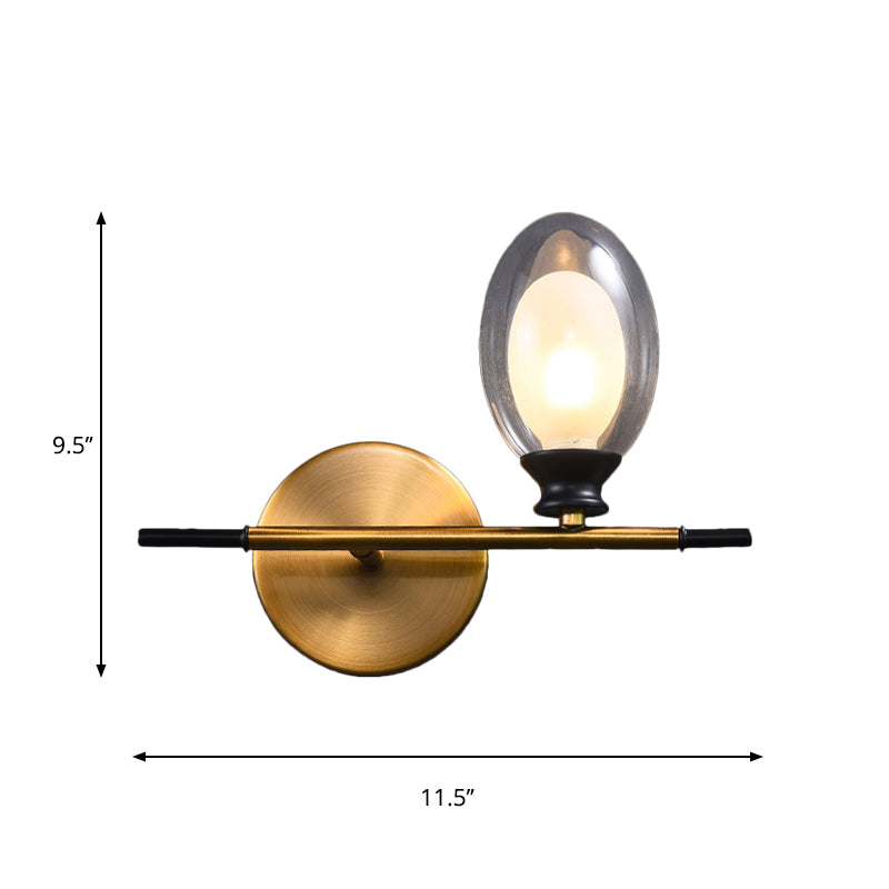 Clear/Amber Glass Egg Shape Wall Light Fixture Minimalist 1 Light Brass Sconce with Horizontal Arm Clearhalo 'Cast Iron' 'Glass' 'Industrial' 'Modern wall lights' 'Modern' 'Tiffany' 'Traditional wall lights' 'Wall Lamps & Sconces' 'Wall Lights' Lighting' 275246