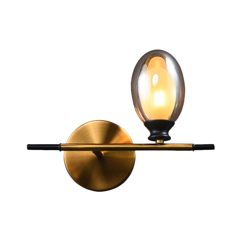 Clear/Amber Glass Egg Shape Wall Light Fixture Minimalist 1 Light Brass Sconce with Horizontal Arm - Clearhalo - 'Cast Iron' - 'Glass' - 'Industrial' - 'Modern wall lights' - 'Modern' - 'Tiffany' - 'Traditional wall lights' - 'Wall Lamps & Sconces' - 'Wall Lights' - Lighting' - 275250