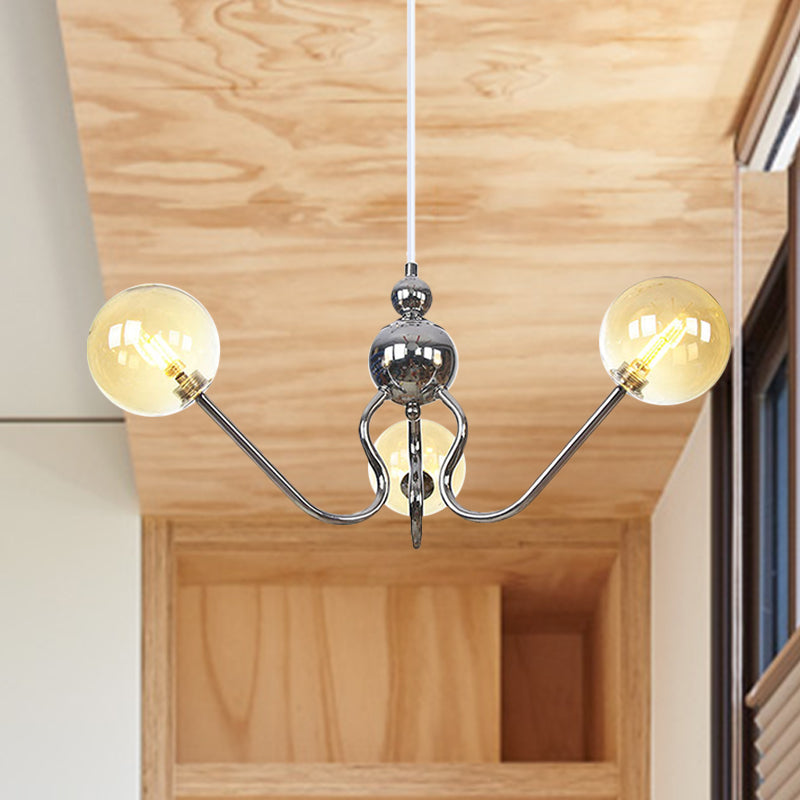 Industrial 3 Heads Hanging Chandelier Lamp with Amber/Clear Glass Shade Black/Chrome Finish Orbit Ceiling Lighting Chrome Amber Clearhalo 'Cast Iron' 'Ceiling Lights' 'Chandeliers' 'Industrial Chandeliers' 'Industrial' 'Metal' 'Middle Century Chandeliers' 'Rustic Chandeliers' 'Tiffany' Lighting' 281228