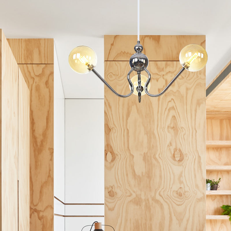 Industrial 3 Heads Hanging Chandelier Lamp with Amber/Clear Glass Shade Black/Chrome Finish Orbit Ceiling Lighting Clearhalo 'Cast Iron' 'Ceiling Lights' 'Chandeliers' 'Industrial Chandeliers' 'Industrial' 'Metal' 'Middle Century Chandeliers' 'Rustic Chandeliers' 'Tiffany' Lighting' 281230