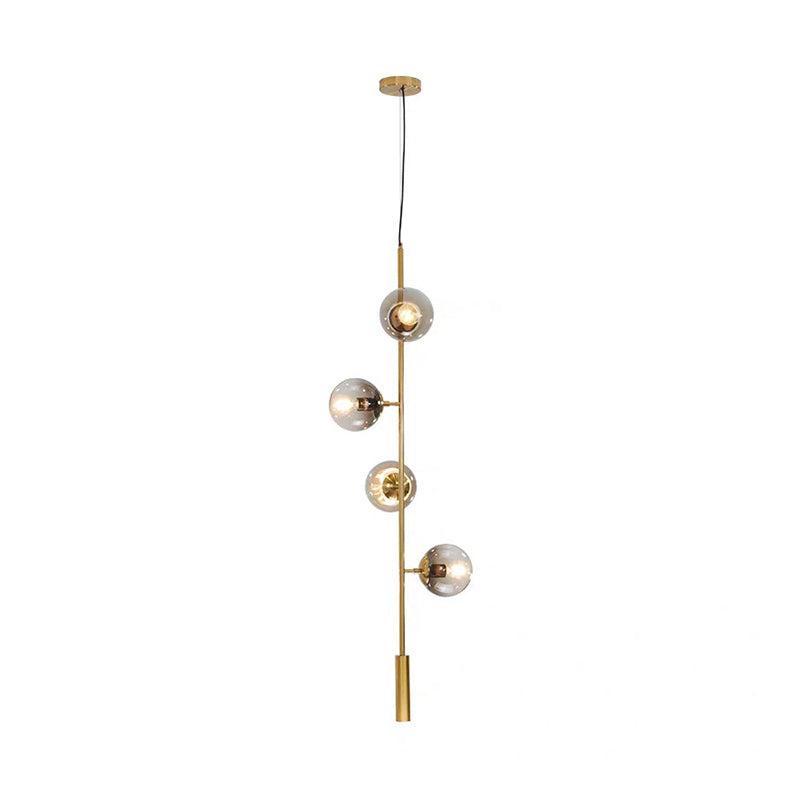 Modernist Globe Pendant Lighting Grey Glass 4 Bulbs Living Room Ceiling Chandelier in Gold with Pencil Arm Clearhalo 'Ceiling Lights' 'Chandeliers' 'Glass shade' 'Glass' 'Modern Chandeliers' 'Modern' 'Pendant Lights' Lighting' 303475
