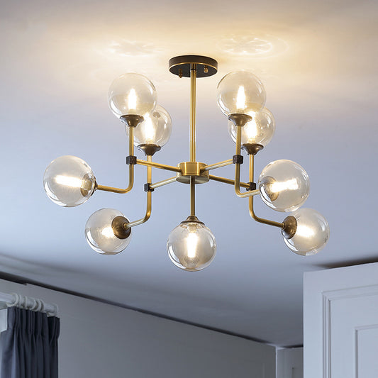 Amber Glass Globe Semi Flush Modernist 9/13 Bulbs Ceiling Mount Light Fixture in Brass 9 Brass Clearhalo 'Ceiling Lights' 'Chandeliers' 'Close To Ceiling Lights' 'Close to ceiling' 'Glass shade' 'Glass' 'Semi-flushmount' Lighting' 303744
