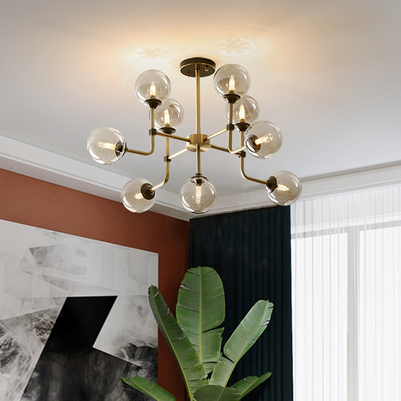 Amber Glass Globe Semi Flush Modernist 9/13 Bulbs Ceiling Mount Light Fixture in Brass Clearhalo 'Ceiling Lights' 'Chandeliers' 'Close To Ceiling Lights' 'Close to ceiling' 'Glass shade' 'Glass' 'Semi-flushmount' Lighting' 303745
